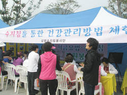 신양산지회, 서금요법 자원봉사 실시